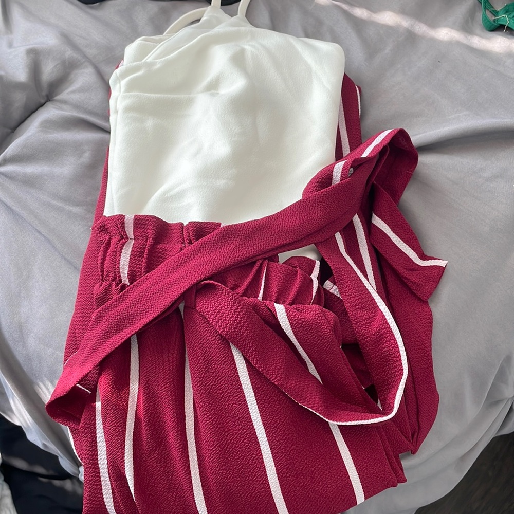 Jumpsuit from blue rain it is red and white with white stripes on my pants
